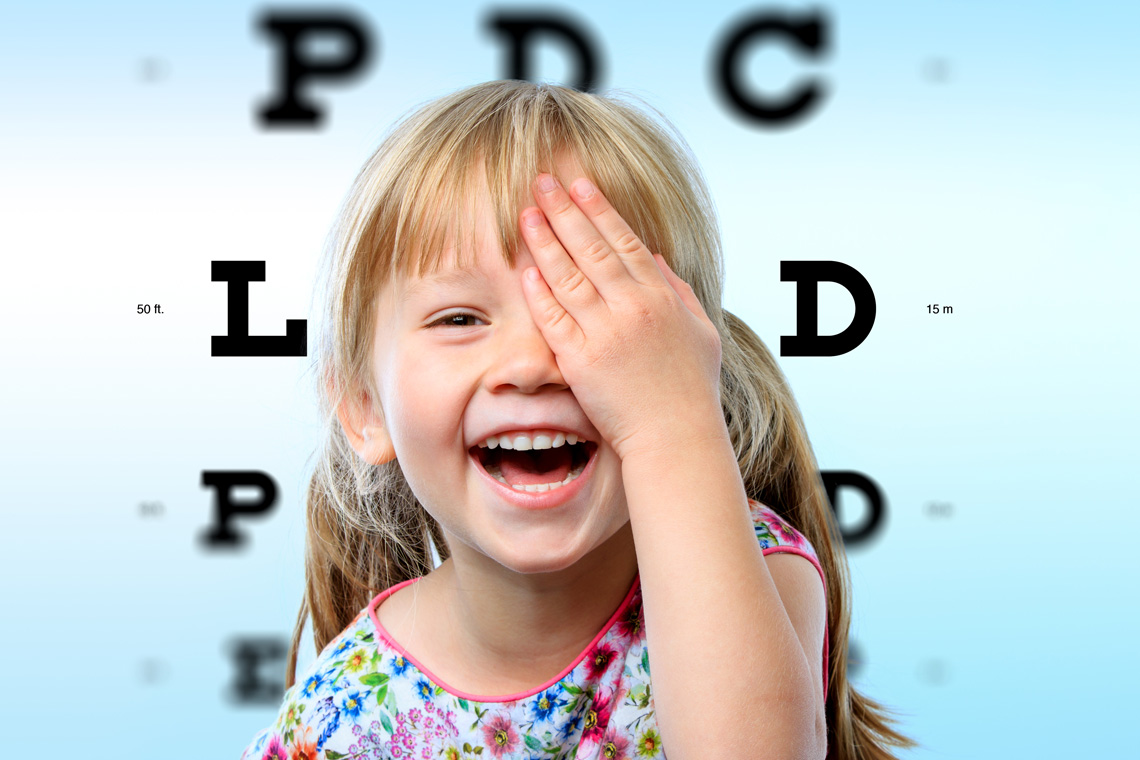 close-up-face-portrait-of-happy-girl-having-fun-at-vision-test-conceptual-image-with-girl-closing-on