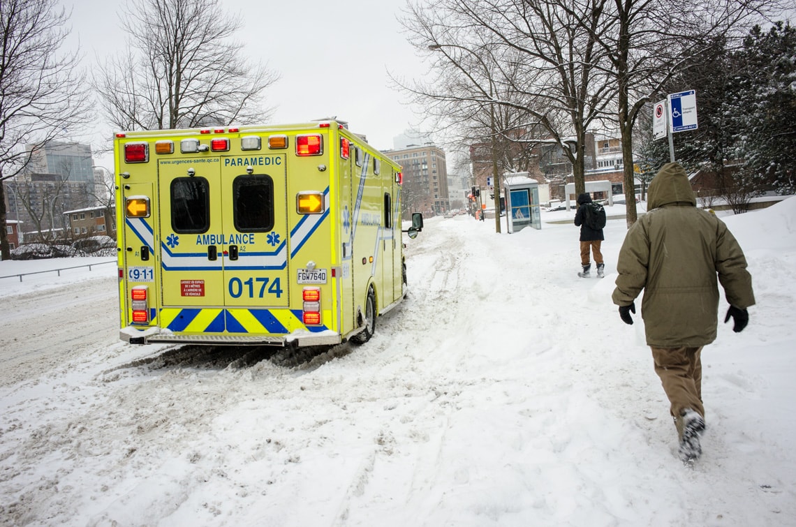 montreal-canada-on-a-freezing-snowy-day-with-rain-yellow-ambulance