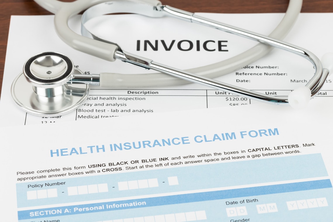 health-insurance-claim-form-and-invoice-with-stethoscope-invoice-and-form-are-mock-up