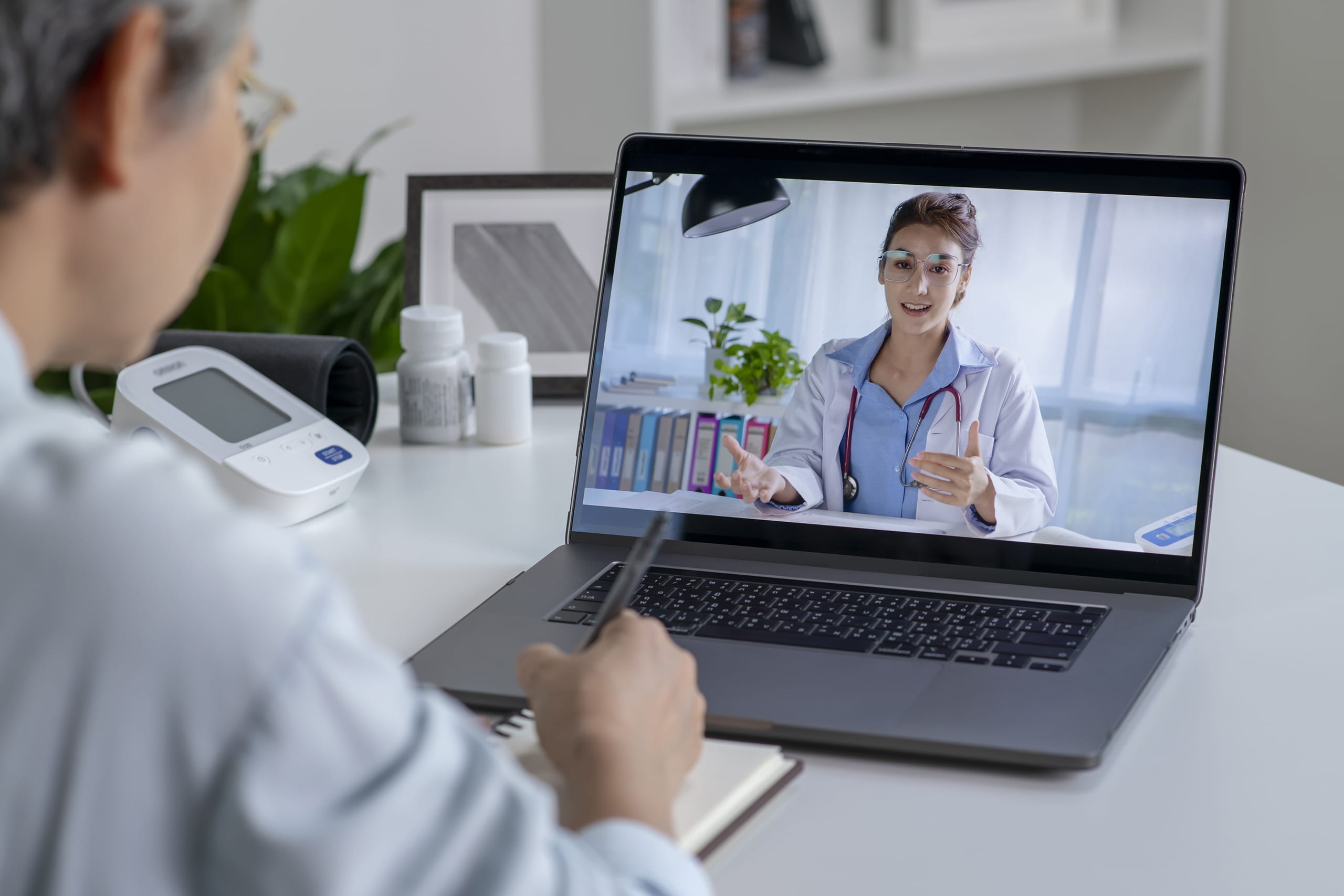 Special Benefits Insurance Services | Trouble Finding a Family Doctor? Your Health Insurance Can Help. A virtual care appointment taking place via video call on a laptop