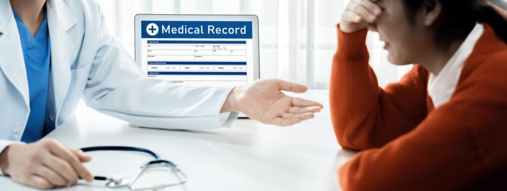 Doctor talking to distraught patient