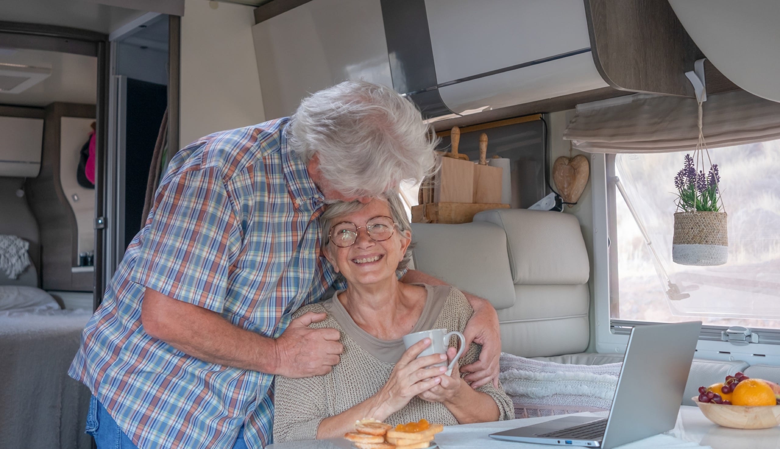 Happy couple inside an RV